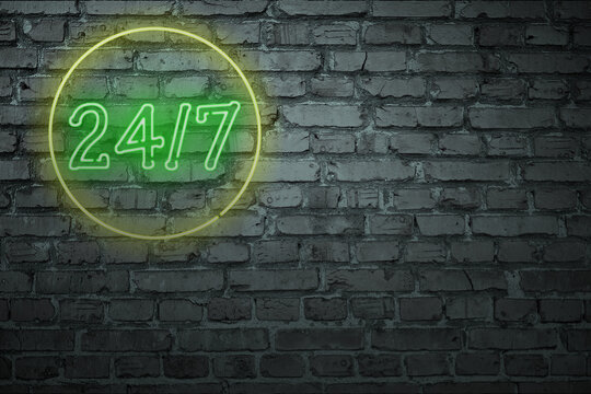 Old type neon sign on a brick wall.