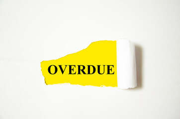 OVERDUE the text is written on a white background and a yellow piece of paper. word