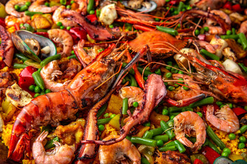 Paella. Spanish dish of rice and seafood, vegetables and chicken. Shrimp, octopus, crab and mussels. Banquet festive dishes. Gourmet restaurant menu. White background. Pattern