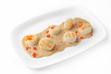 Delicate fragrant scallops in a creamy sauce with red caviar. Seafood dish. Gourmet restaurant menu. White background. 