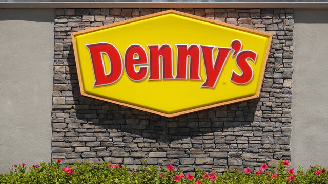 Vista, CA USA - April 29, 2021: Close up of Denny's logo on a decorative stone wall