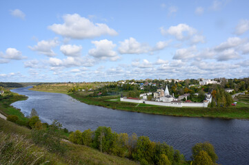 Fototapeta na wymiar View of the Volga River, the town and the Staritsky Holy Dormition Monastery, Staritsa, Tver region, Russian Federation, September 20, 2020