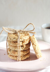 The cookies are in a plate on the table. Sunny. Breakfast