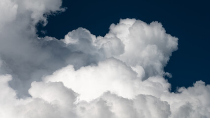 Naklejka na ściany i meble Mountainous Cumulus Clouds Boiling in the Summer Sky