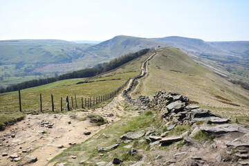 Footpath leading into the distance towards Mam Tor in the background. Mam Tor is a 517m hill near...