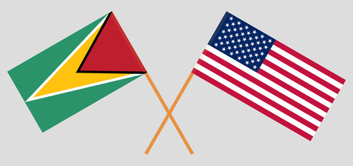 Crossed flags of Guyana and the USA. Official colors. Correct proportion