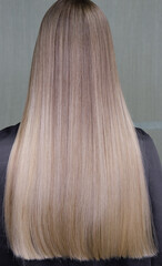 Stunningly beautiful hair models painted in a light color look from the back. selective focus.High quality photo