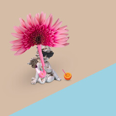 Creative minimal fun idea with a happy angel in sunglasses with sun umbrella of flower and flamingo, enjoying on the beach.
