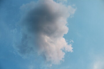 A column of smoke that turned into beautiful clouds