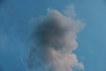 A column of smoke that turned into beautiful clouds