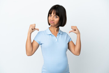 Pregnant woman over isolated white background proud and self-satisfied