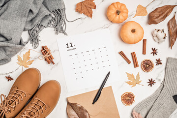 Flat lay with calendar for november with woman fashion fall accessories