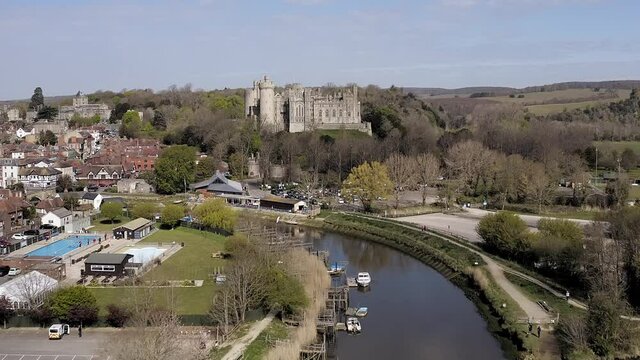Aerial of the River Arun towards Arundel Castle and the historic town of Arundel situated within the beautiful countryside of West Sussex in Southern England.
