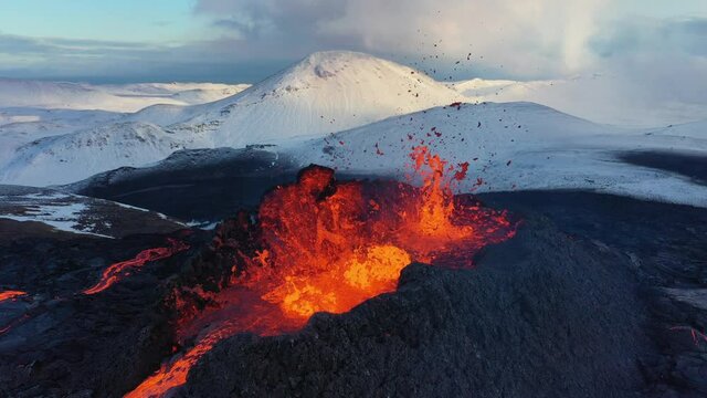4K Drone aerial video of Iceland Volcanic eruption 2021. The volcano Fagradalsfjall is located in the valley Geldingadalir close to Grindavik and Reykjavik. Hot lava and magma coming out of the crater