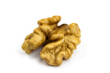 Half a walnut kernel on a white background. Walnut kernel isolated on white background. Peeled walnut on a white background. Piece of pulp of walnut.