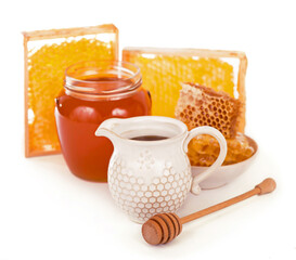 glass pot with floral honey isolated on white background.
