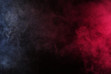 Obraz na płótnie Canvas Smoke in white-red light on a black background