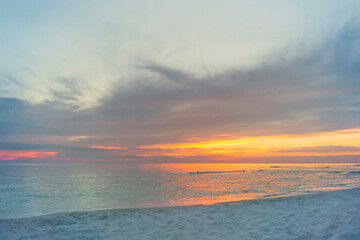 white sand on gulf beach at sunset