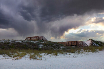 storm sky boardwalk to beach sand dunes