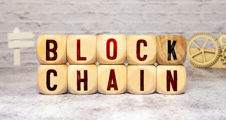 Blockchain word written on wood block. Block chain text on wooden table for your design concept