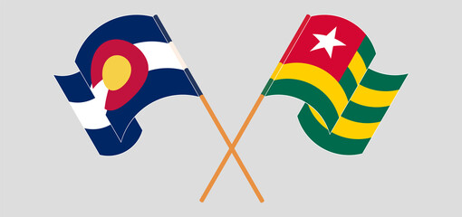 Crossed and waving flags of The State of Colorado and Togo