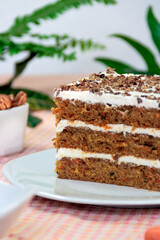 homemade carrot cake with cream and nuts. 