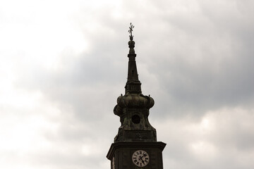 The spire of one of the temples of Brno. A dark tower against a gloomy sky.