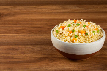 Bowl with instant noodles on the table.