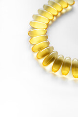 Obraz premium Close up of food supplement oil filled capsules suitable for: fish oil, omega 3, omega 6, omega 9, evening primrose, borage oil, flax seeds oil, vitamin A, vitamin D, vitamin D3, vitamin E.