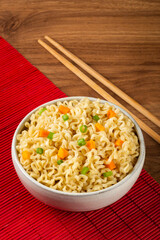 Bowl with instant noodles on the table.