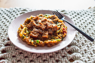 vegan Korean teriyaki sticky tofu with stir fry vegetables, healthy plant-based food