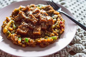 vegan Korean teriyaki sticky tofu with stir fry vegetables, healthy plant-based food