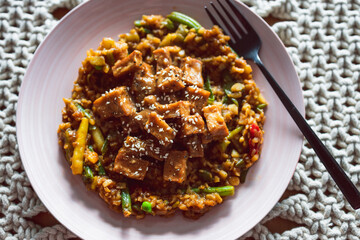 vegan Korean teriyaki sticky tofu with stir fry vegetables, healthy plant-based food