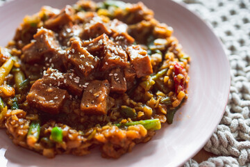 vegan Korean teriyaki sticky tofu with stir fry vegetables, healthy plant-based food