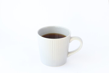 コーヒーの入ったマグカップ　白背景