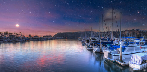 Moon and stars over boats at the harbor of Dana Point - obrazy, fototapety, plakaty