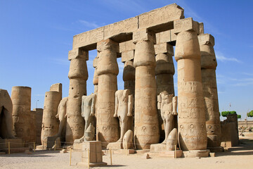 Ruins of stone columns and statues at the Temple of Karnak, Luxor, Egypt