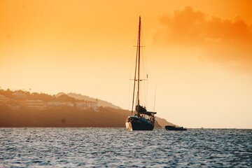 island sunset with boat