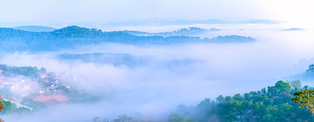 The morning scenery on the hillside in the misty highlands below the beautiful valley