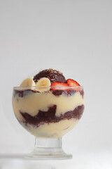 Brazilian açaí with granola, condensed milk, strawberry and banana. Copy space.