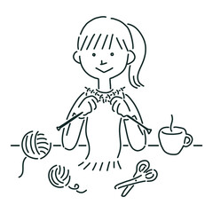 編み物をする女性　マフラーを編む