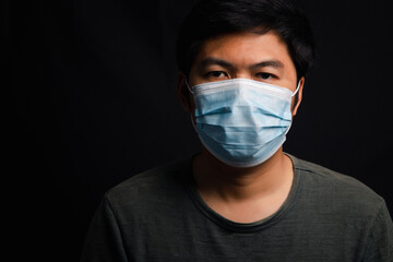 Asian men wear masks to prevent COVID-19