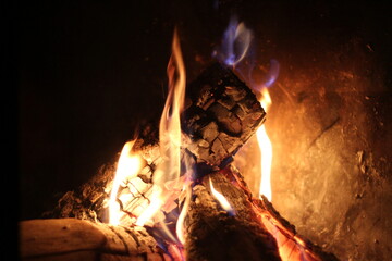 firewood burning in a cave