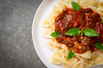 farfalle pasta with basil and garlic in tomato sauce