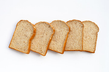 Sliced whole wheat bread on white background.