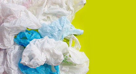 Fototapeta premium Crumpled plastic bags on green background.