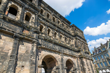 Fototapeta na wymiar Fragment of Antique gate of Porta Nigra (Black Gate) in the center of Trier.