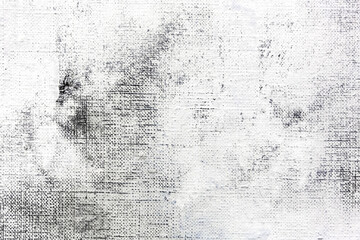 textured abstract painting. hand painted white color on gray canvas background.