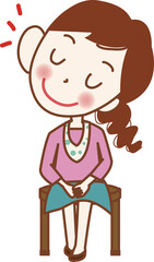 椅子に座って話を聞いている若い女性。