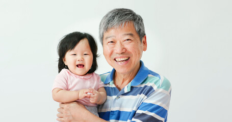 grandfather hug his granddaughter